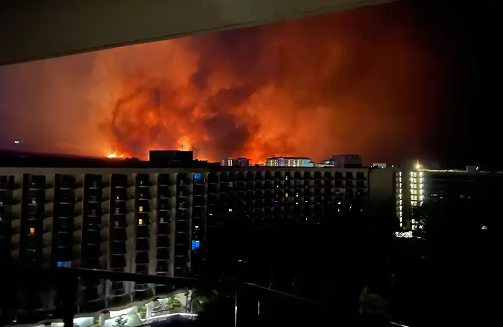Lahaina wildfire photographed from a balcony in Maui.