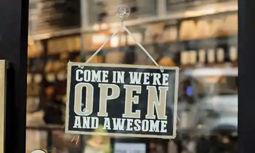 Store OPEN Sign with thr message, "Come in We're OPEN and Awesome"