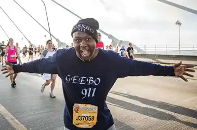 A bridge runner poses for a photo