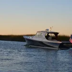 Local charters that will float your boat. PHOTO: A charter boat with the Arthur Ravenel Jr. Bridge in the distance.
