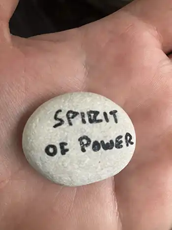 A rock with "Spirit of Power" written on it. The whole bible verse is, '​​For God gave us a spirit not of fear but of power and love and self-control.' - 2 Tim 1:7