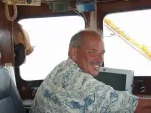Photo of Captain Magwood at the helm