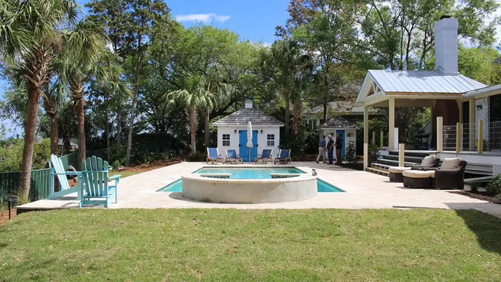 Photo: gorgeous backyard with a pool and cabana. Photo by Carl Owners Contracting.