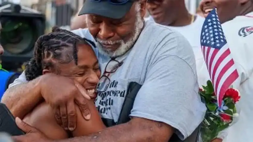 Georgetown native Melissa Jefferson hugs her father, Melvin Jefferson.