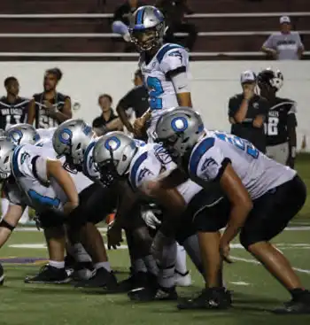 The Oceanside Landsharks football team on the field.