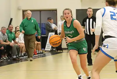 BEHS Lady Bishops Coach Paul Runey encourages a fast break by veteran guard Hannah Rosato.