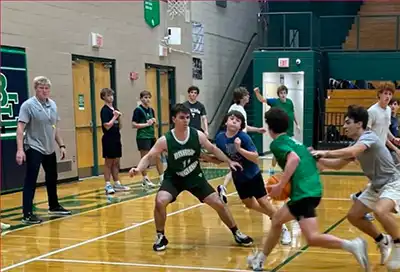 Bishop England Battling Bishops Boys Basketball: Coach Eykyn oversees a practice.