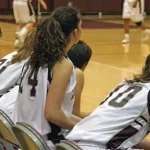 Girls basketball game as viewed from the sidelines.