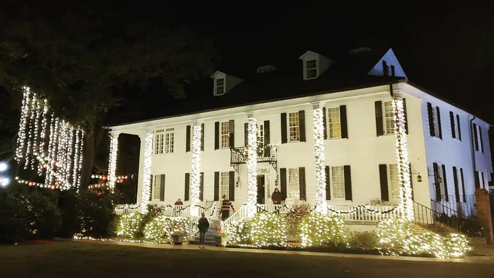 Kaminski House Museum lit up outside with decorative lights.