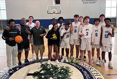 Oceanside Collegiate Academy Landsharks Boys Basketball after a Team Camp Win.