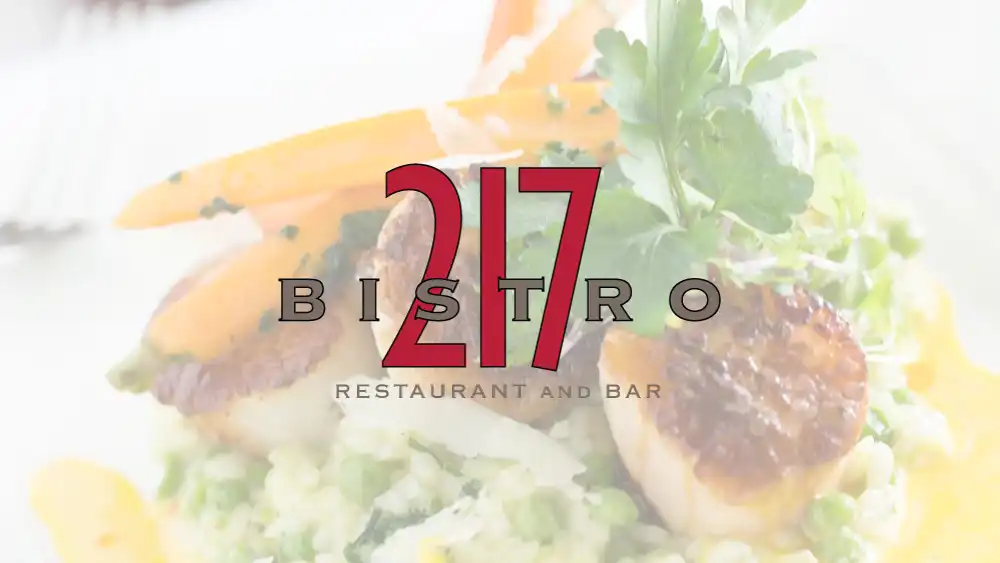 Bistro 217 logo with a background of scallops