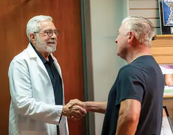 Dr. Stuart Markovitz greets a patient at Charleston Men's Clinic.