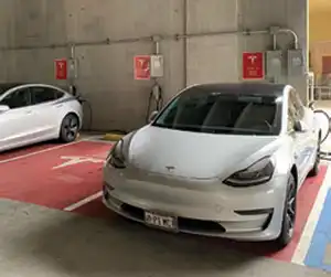 2 EVs at an EV Charging Station.