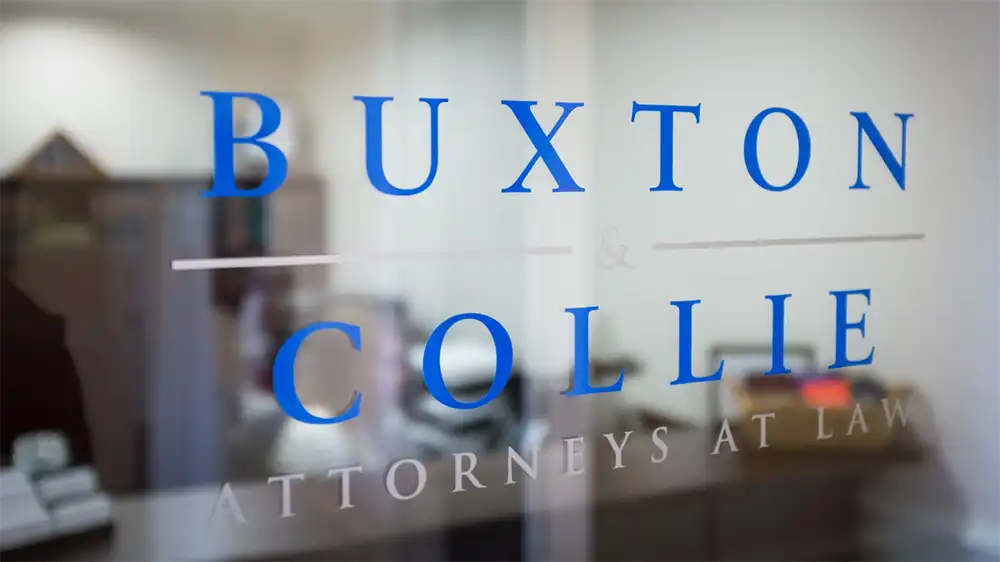 Buxton and Collie Attorneys at Law on a door inside the practice in Mount Pleasant, SC.