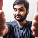 A man giving 2 thumbs up. Photo credit: Usman Yousaf on Unsplash.com