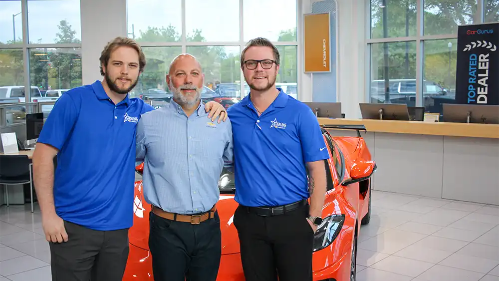Photo of Starling Chevrolet's GM Joe Sarro (center) with his sons Jarrett and Joey.