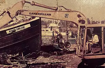 A caterpillar works in front of the wrecked trawler Richard and Charlene.