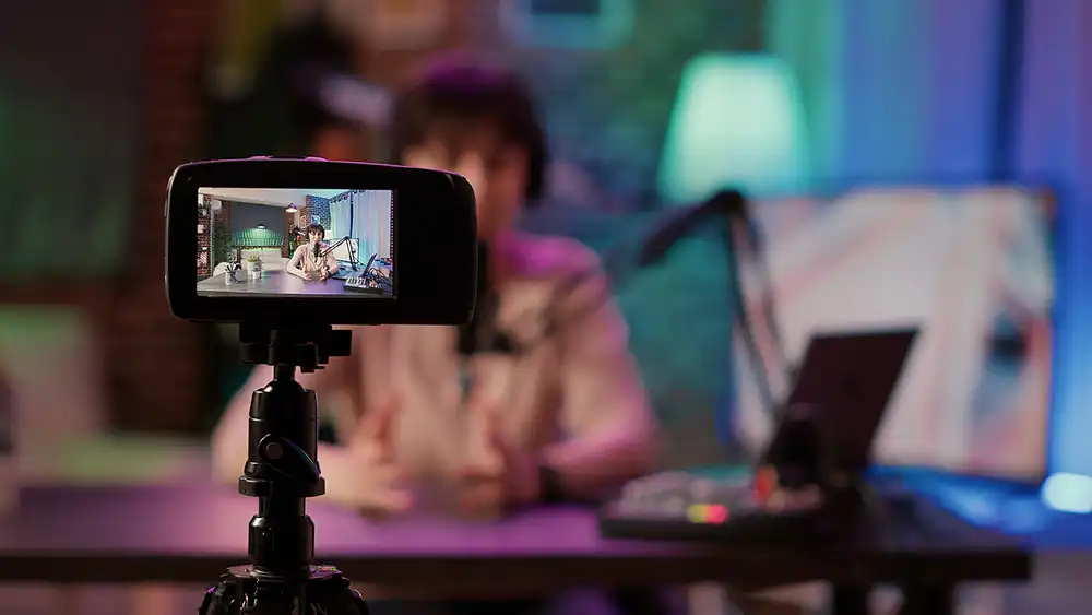 Mom Influencers, momfluencers photo. A video camera in the foreground with a blurred background