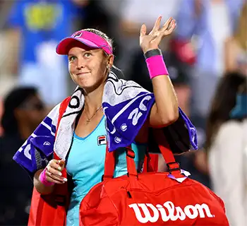 Shelby Rogers on court waving. Photo courtesy of Charleston Tennis LLC.