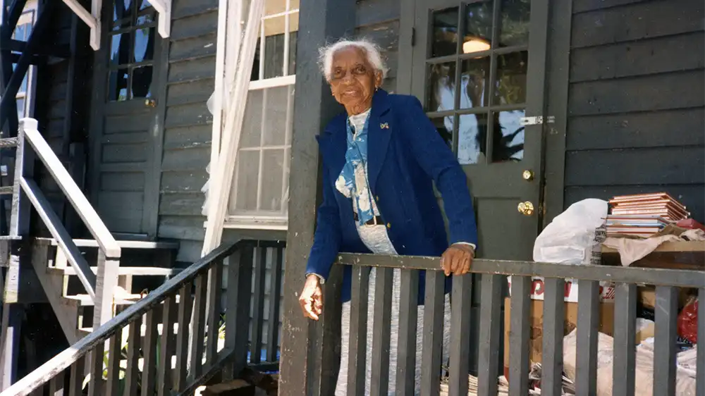 Miss Ruby Forsythe outside her flat above the one-room schoolhouse where she taught.