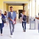 High school students walking through a hallway
