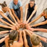 Class members at Yoga Daily in Mount Pleasant, SC stretching