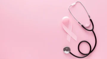 Breast Cancer Awareness graphic. A pink ribbon, stethoscope with pink ear tubes on a pink background