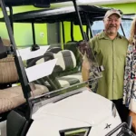 Chad Shores and Andrea Leary posing with a popular-selling LSV at Rad Rydz.