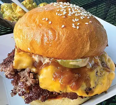 Smashed quarter-pound burger by BlackOut Burger