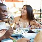 Friends enjoying a meal at a Mount Pleasant restaurant.