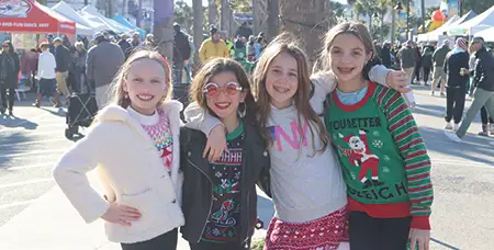 Smiling girls at the Holiday Street Festival