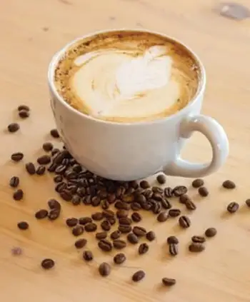 Coffee with coffee beans and latte art