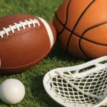 Sports equipment: A football, basketball, lacrosse ball and lacrosse stick (crosse)