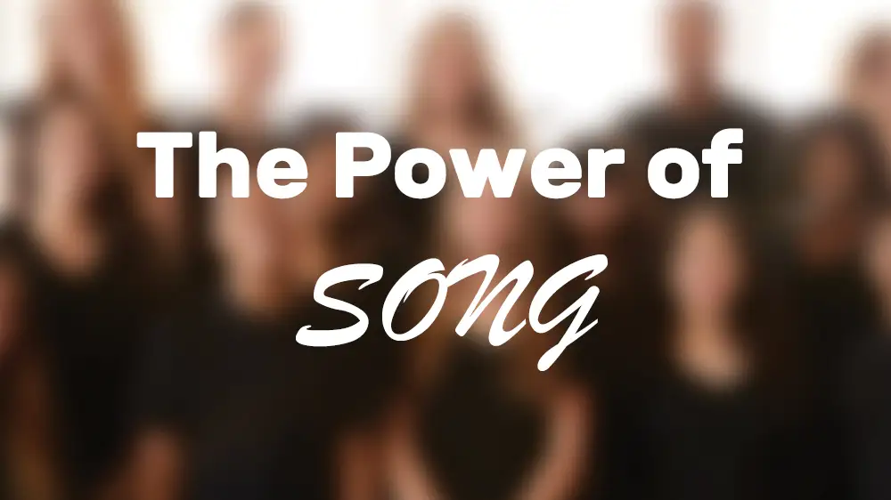 HEADER: The Power of Song, with blurred singers in the background