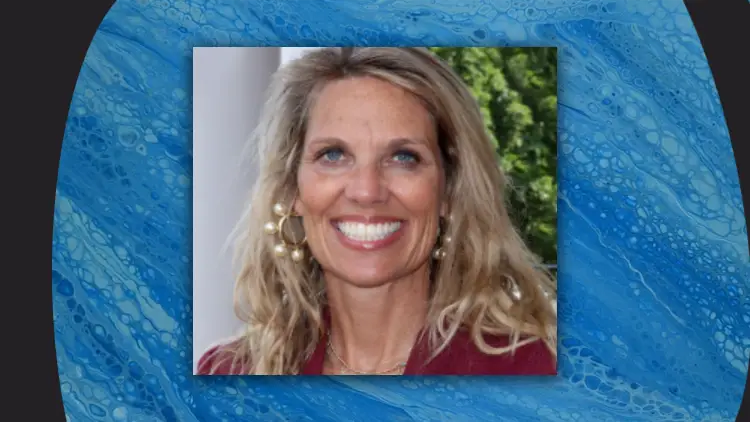 Headshot of Dr. Kelly Linkenhoker, the incoming principal of Oceanside Collegiate Academy, centered against an abstract blue water-textured background.